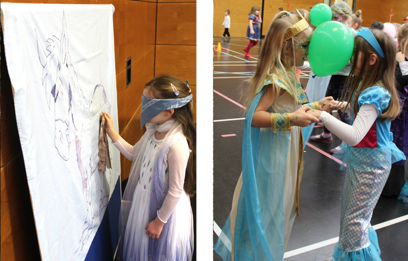 Kinder malen mit verbundenen Augen Figuren auf ein Flipchart. Zwei andere tanzen in Kostümen mi einem Luftballon.